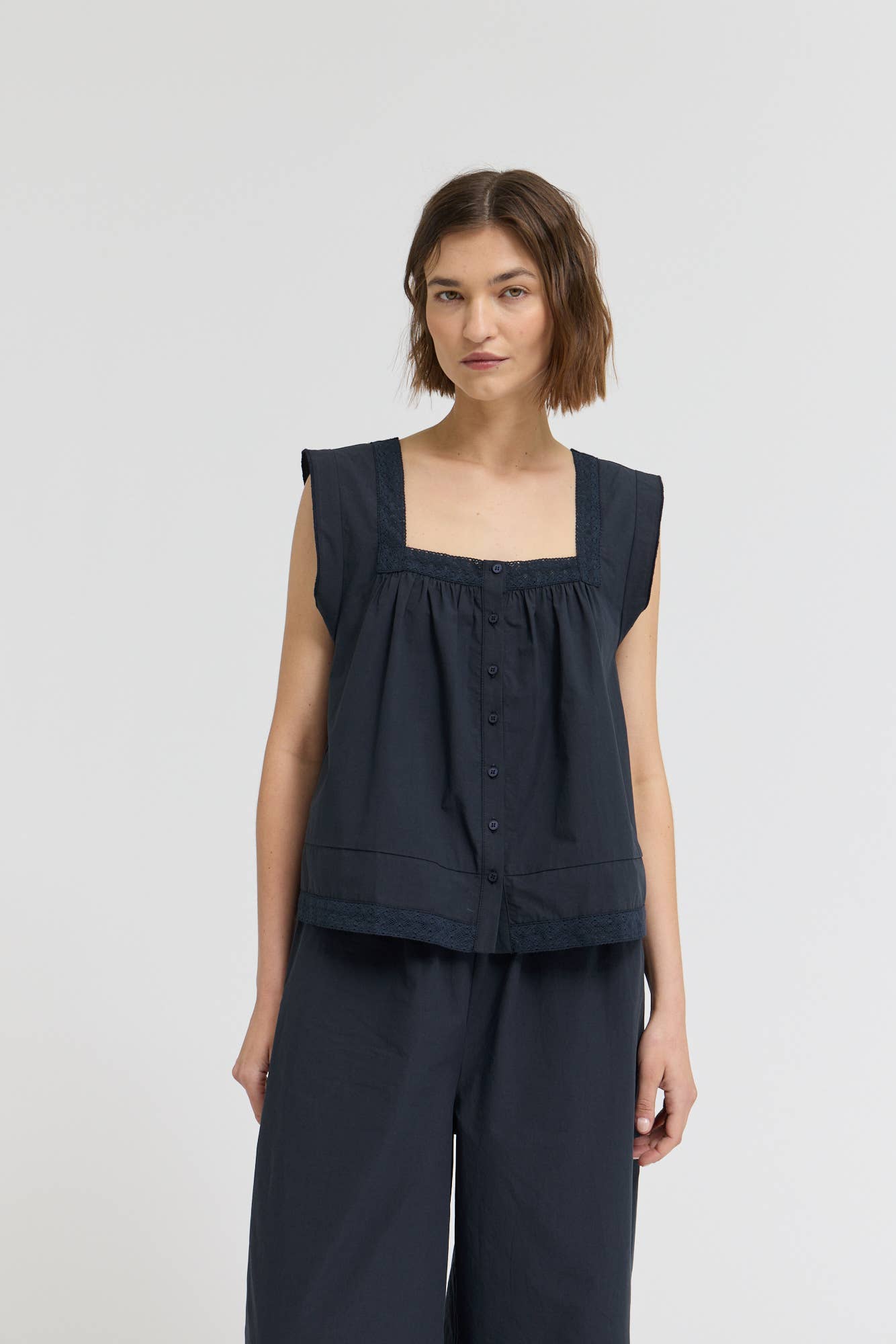 Eyelet Trim Detailed Sleeveless Top