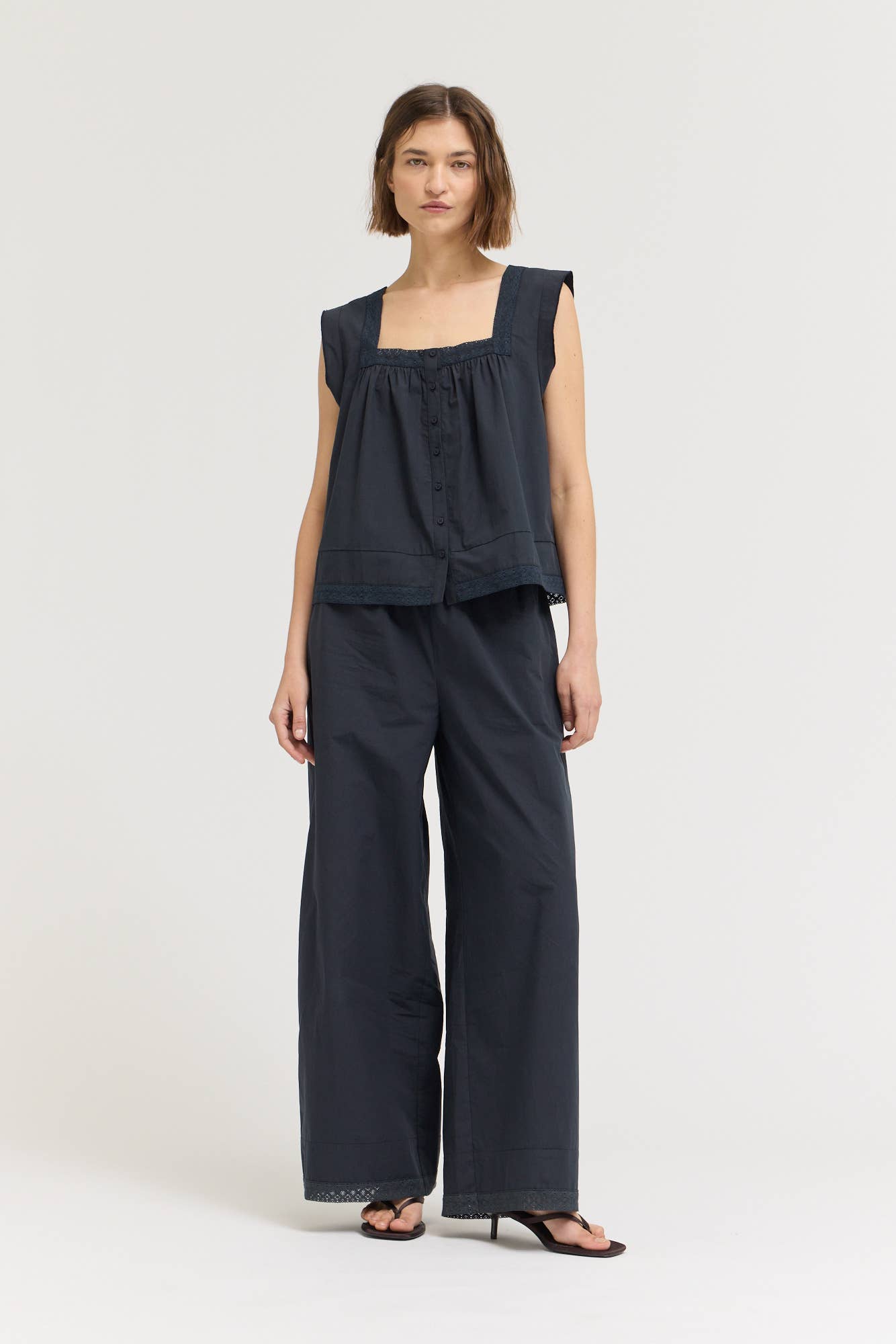 Eyelet Trim Detailed Sleeveless Top