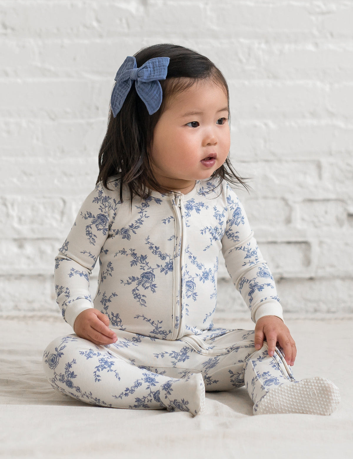 82701-18-peyton-zipper-footed-sleeper.serena-floral-rain.fit_front_1200x_a12f0a53-55fd-4290-b7b3-a363a4cbf199.jpg