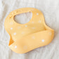 Mushie Silicone Baby Bib - Sun