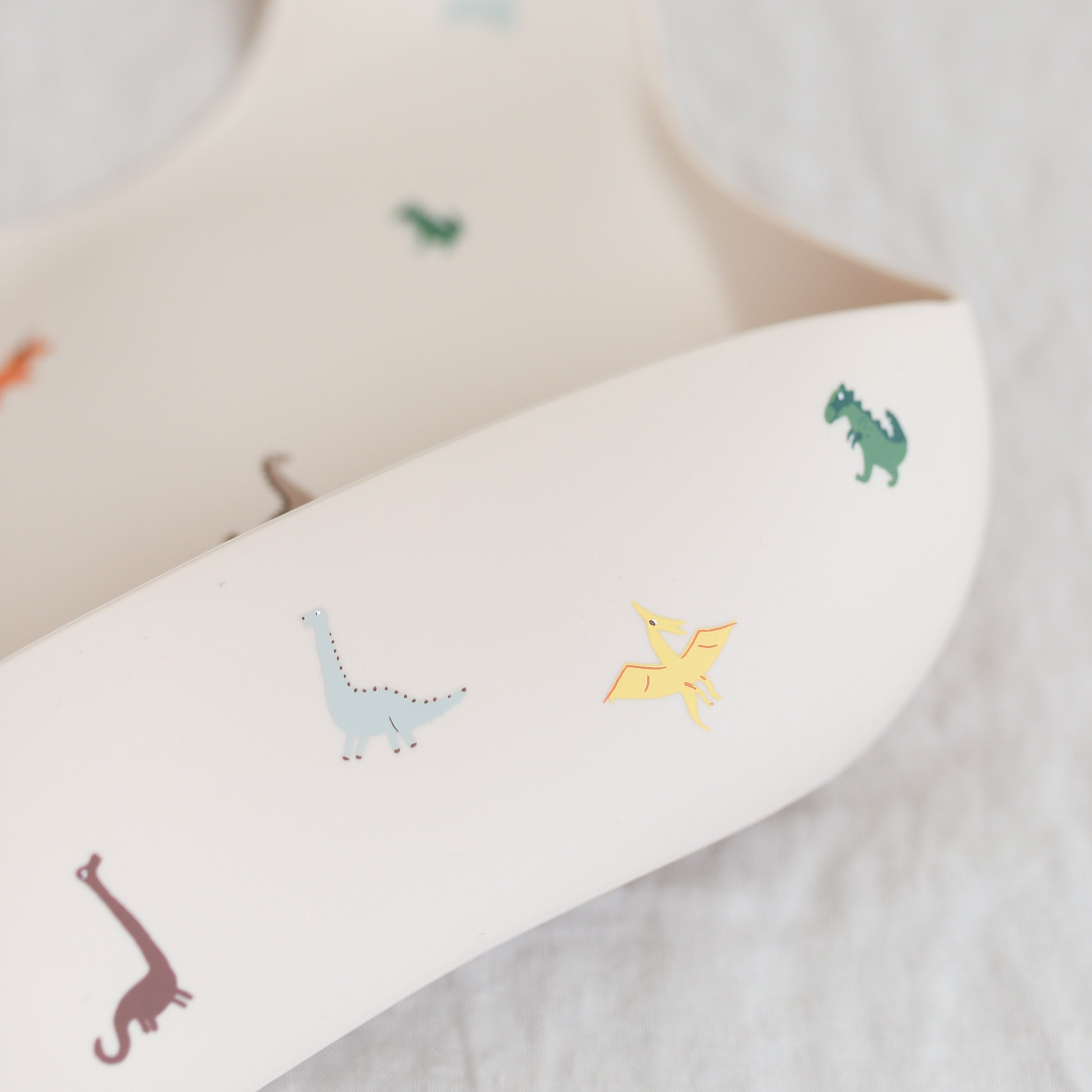 Mushie Silicone Baby Bib - Dinosaurs